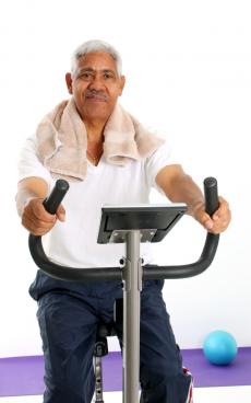 Older gentlleman on an elliptical machine